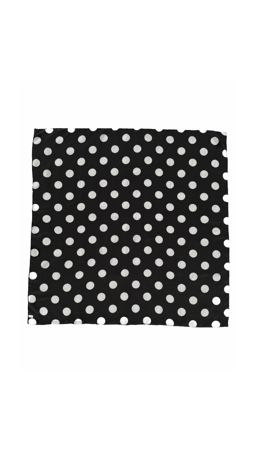 Australian designer silk scarf by nessi in black with a classic white polka dot print.