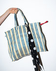 Handmade silk skinny scarf tied on a bag, black with white polka dots, by nessi, an Australian independent fashion label.