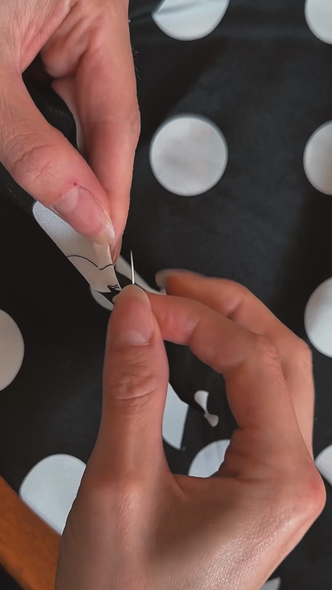 A hand-rolled hem finish on silk scarf by Australian brand nessi